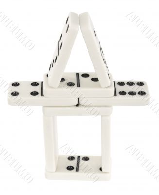 Small tower made of dominoes bones Small tower made of dominoes bones