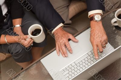 Man and Woman Using Laptop with Coffee Man and Woman Using Laptop with Coffee