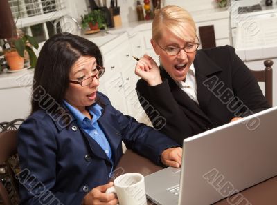 Businesswomen Celebrate Success on the Laptop