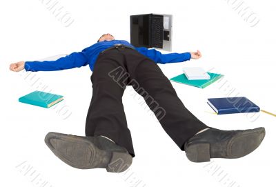 Businessman lies on a floor among the things