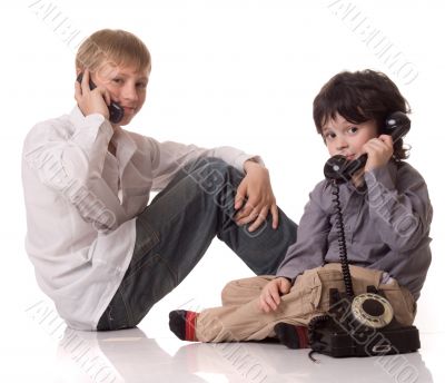 Two boys with a telefone