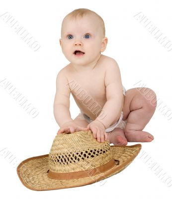 Baby on a white background with straw hat Baby on a white background with straw hat