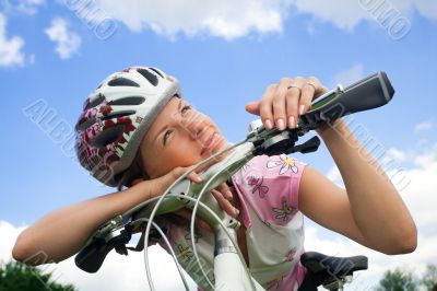 Bike girl looking at the sun