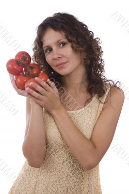 Woman holding branch of red tomatoes Woman holding branch of red tomatoes