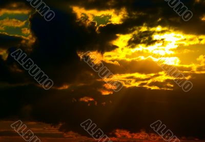 Sun behind storm-cloud