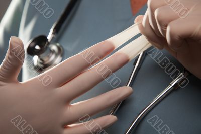 Abstract of Doctor Taking Off Latex Gloves
