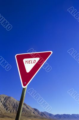yield sign at the blue sky