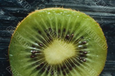 Green kiwi fruit slice.