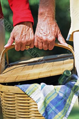 Senior Couple Carrying Picnic Basket