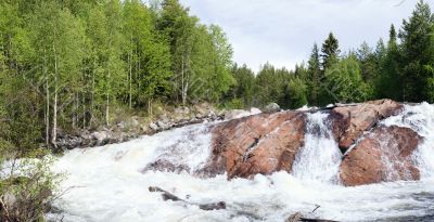 Panoramic photo of a waterfall  - summer