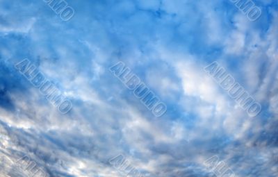 Plumose clouds in the dark blue sky