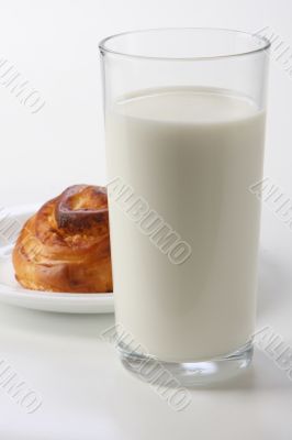 glass with milk and bun