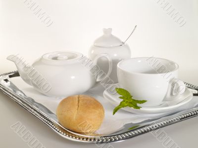 breakfast still-life with dishware and mint leafs