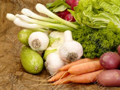fresh tasty vegetables on brown background