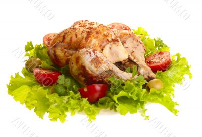 grilled chicken whole with vegetables on salad leafs