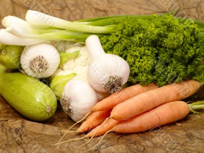 fresh tasty vegetables on brown background