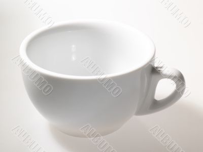 empty tea cup on the table under bright light