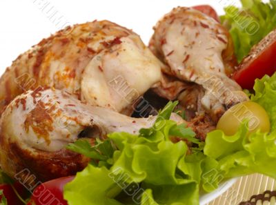 grilled chicken whole with vegetables on salad leafs