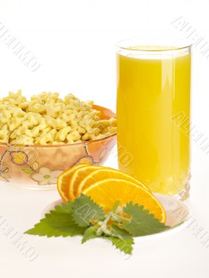 Orange juice with sliced  fruit and corn flakes