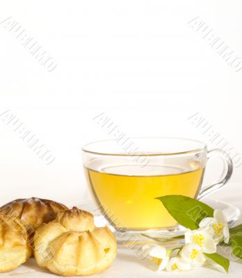 breakfast still-life. green tea with cookies and fresh jasmine