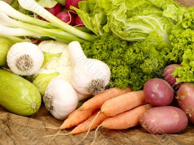 fresh tasty vegetables on brown background