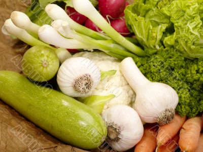 fresh tasty vegetables on brown background