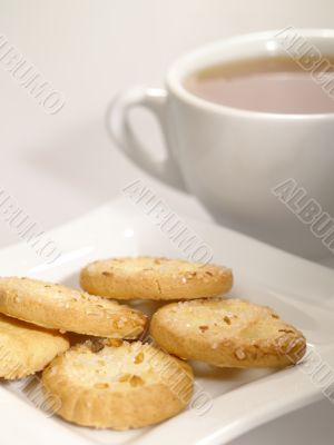 tea cup with cookies on the plate