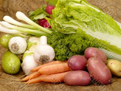 fresh tasty vegetables on brown background