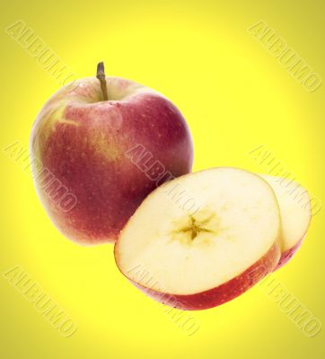sliced apple on yellow background