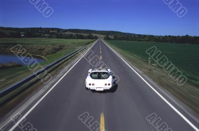 Carefree Convertible Driving Down Open Road