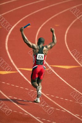 Victorious Relay Race Runner Carrying Baton