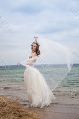 beautiful bride  dancing on the beach