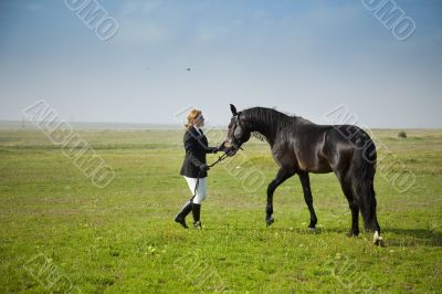 horsewoman trains the horse / summer