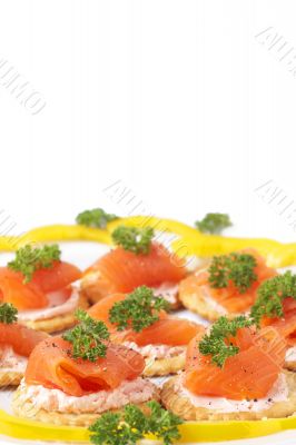 Smoked salmon and cream cheese on crackers