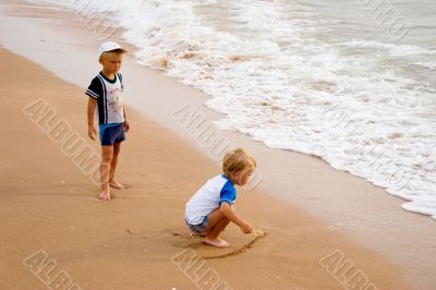 Little boys on seacoast.