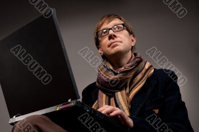 man with laptop computer smiling