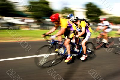 Tandem cyclists compete motion blur