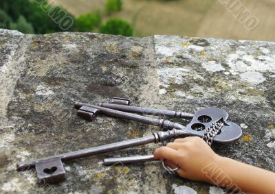 Child holding keys of Medieval castle