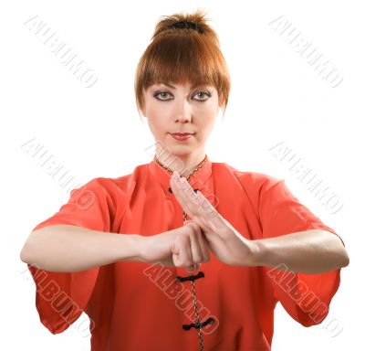 young woman makes chinese greeting gesture