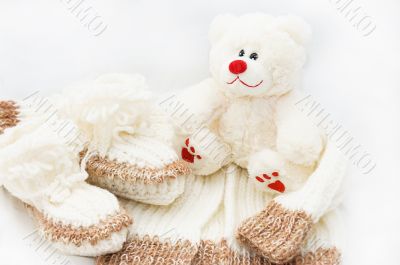 Wool hand-made baby coat, socks and teddy bear
