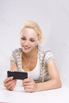 An attractive woman checking her cell phone