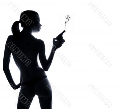 Thin sexy woman from behind holding a gun