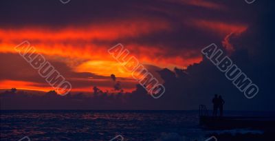 couple watching sunset on ocean  Dominican republic