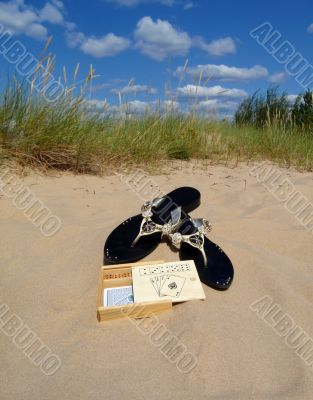 shoes cards sand sky