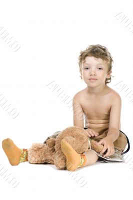 little boy play toy bear on white little boy play toy bear on white