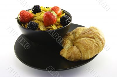 Cornflakes in a Black Bowl with a Croissant