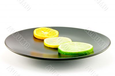 Citrus Slices on a Black Plate