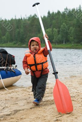 Little boy with an oar