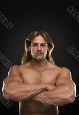 Sexy muscular man isolated on black