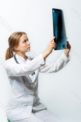 pretty young blonde doctor with x-ray picture